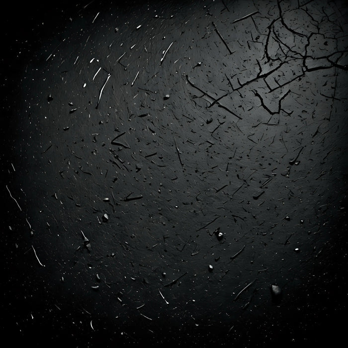 Dark cracked surface with scattered debris, textured background for Black Friday discount sale