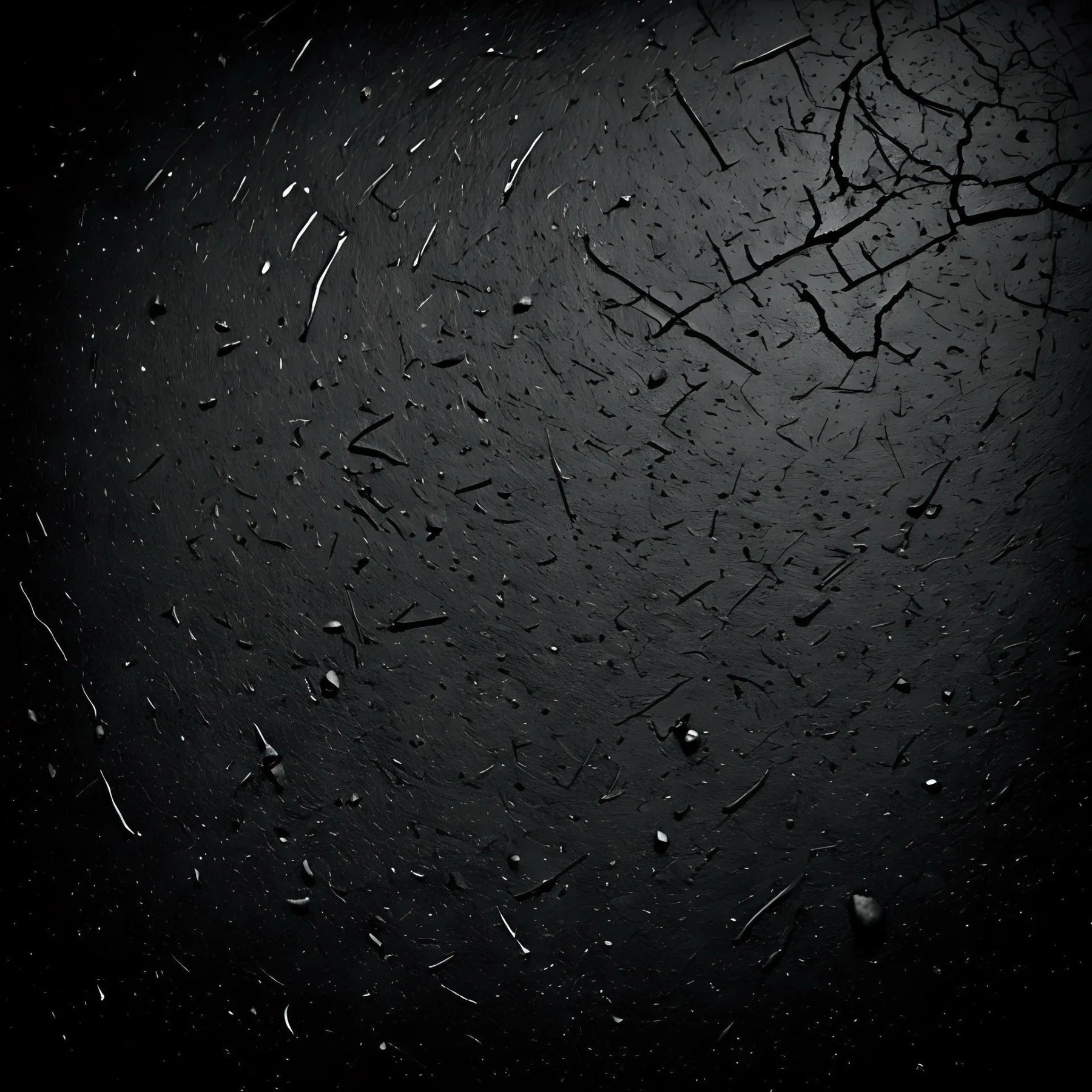 Dark cracked surface with scattered debris and rough texture, black grunge background