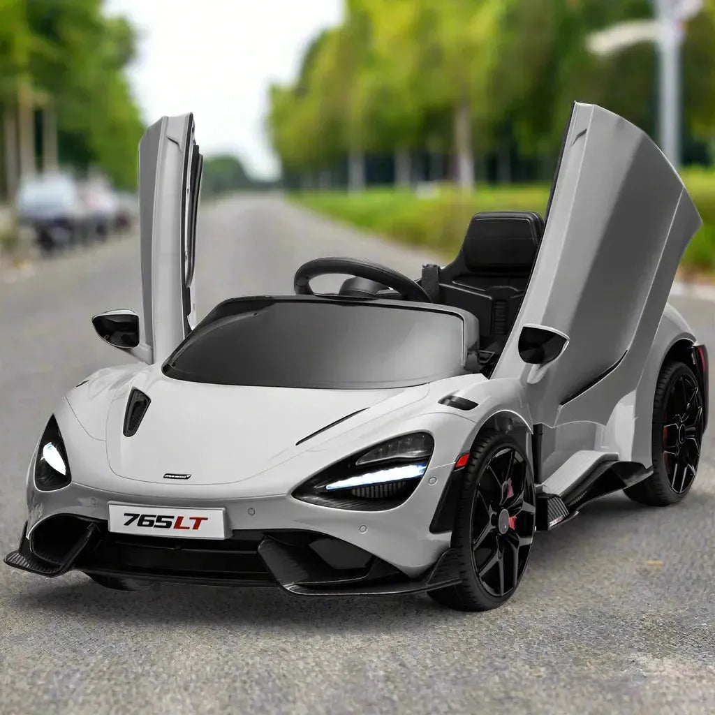 Kids electric toy car McLaren 765LT with open doors on a road outdoors