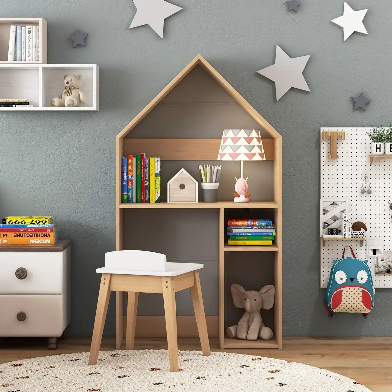 Kids activity table and desk set with bookshelf, toys, and books in a playful nursery.