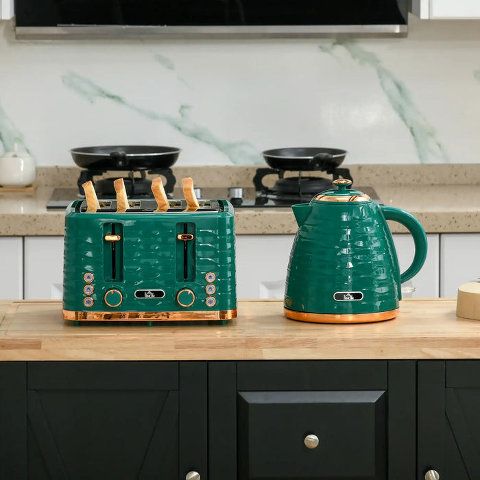 Green ceramic toaster and kettle on a kitchen counter with a marble backsplash.