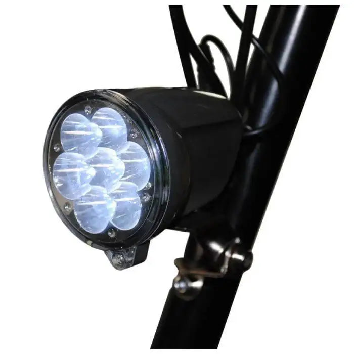 Close-up of a bright multi-LED headlight on a black electric scooter frame