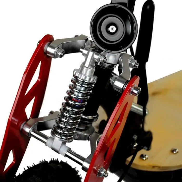 Close-up of 1000W electric scooter suspension with red frame and coil spring