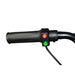 Electric scooter handlebar with red light and green horn buttons, black grip, close-up view