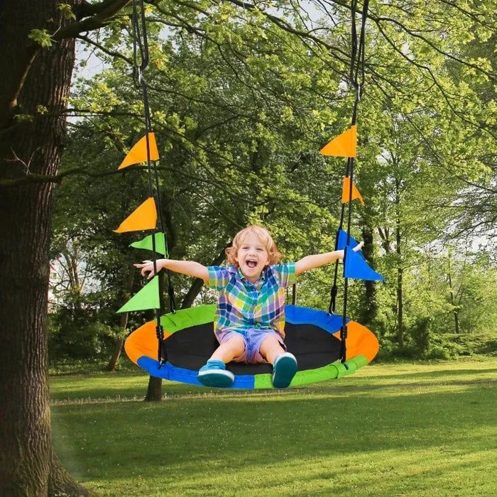 Child on colorful 100cm saucer tree swing with adjustable ropes in outdoor garden