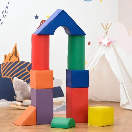 Multi-coloured foam geometric shape set for kids, arranged as blocks in a playroom.