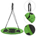 Green round saucer tree swing with black ropes and close-up stitching details