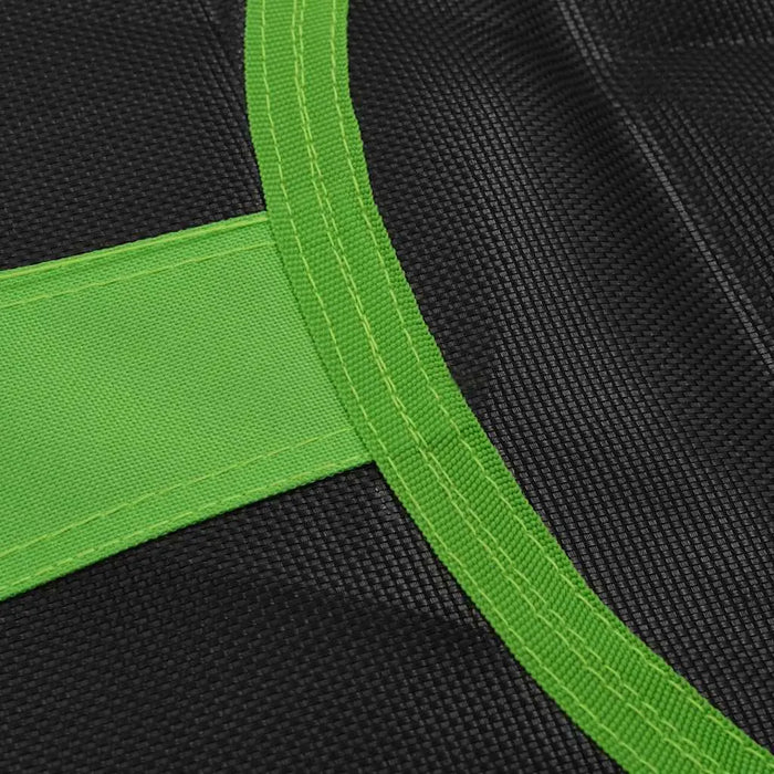 Close-up of black mesh fabric with bright green reinforced stitching and border