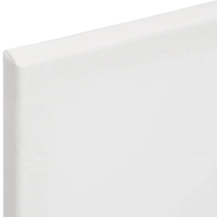 Close-up of a blank white stretched artist canvas with visible corner and edge.