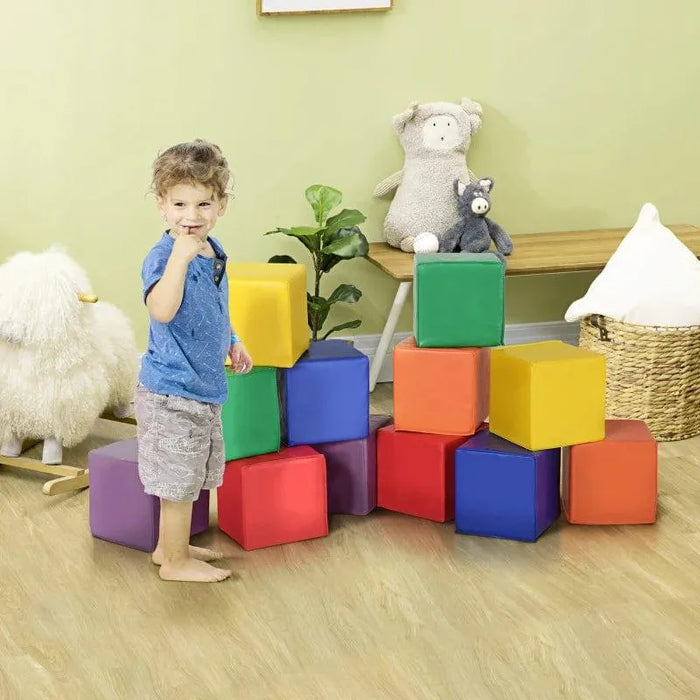 Toddler playing with colorful soft foam activity blocks in a playroom with toys and plants