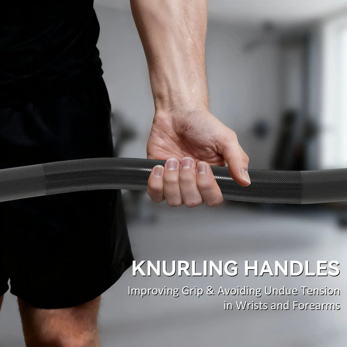 Person holding a barbell with knurling handles in a gym setting