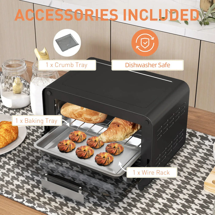 Black countertop oven with baked goods on a kitchen counter, featuring accessories included.