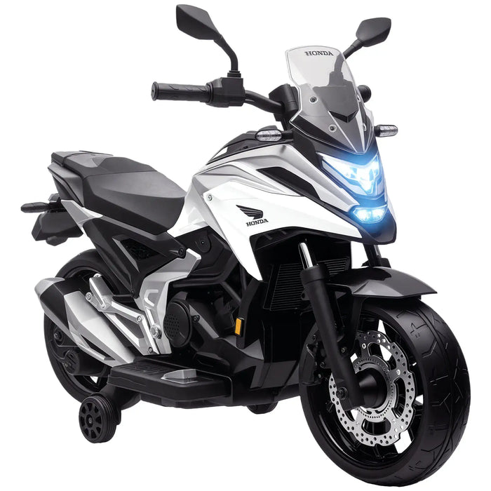 White and black Honda electric kids motorcycle with training wheels and LED headlights