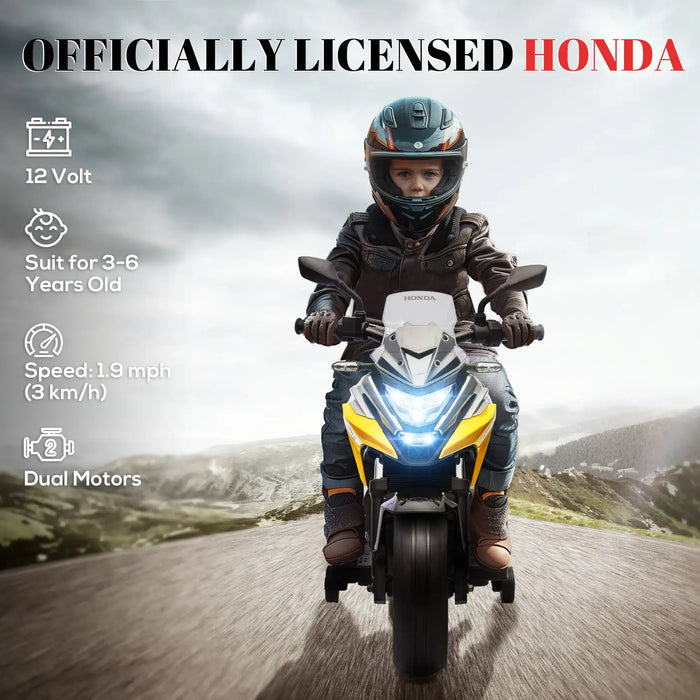 Child riding officially licensed Honda electric toy motorcycle with helmet on road