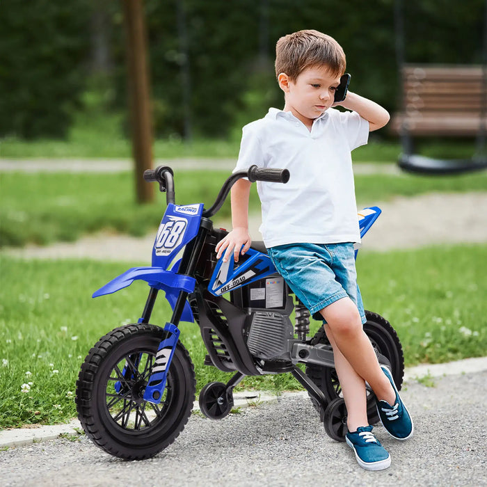 Young boy in white polo and denim shorts leaning on blue off-road toy bike in park