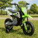 Green and white electric kids dirt bike with training wheels on grass in park