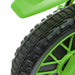 Close-up of a green and black wheel with tire tread pattern on a white background