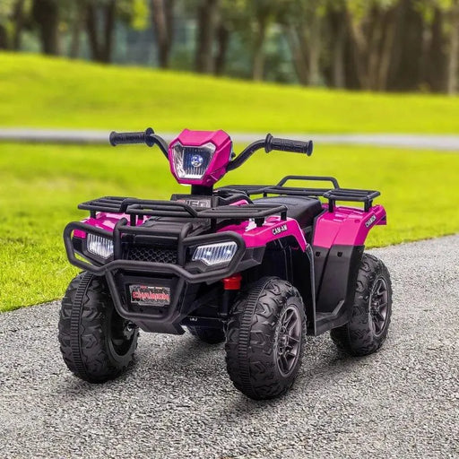 Pink and black 12V kids electric quad bike with LED headlights on a path in a park