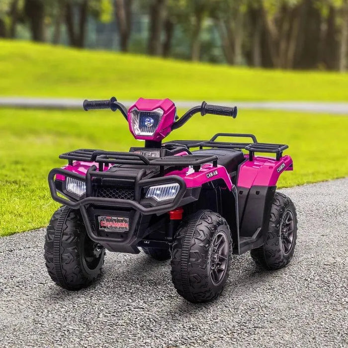 Pink and black 12V kids electric quad bike with LED headlights on a path in a park