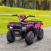 Pink and black 12V kids electric quad bike with LED headlights on a path in a park