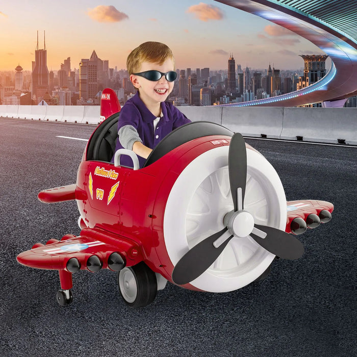 Smiling boy rides red 12V kids electric airplane toy with joysticks on city road at sunset