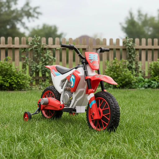 Red 12V kids electric ride-on motorbike with training wheels on green grass outdoors