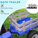 Blue kids electric ride-on tractor with detachable trailer for toy storage on grass