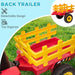 Red and yellow detachable toy tractor trailer on green grass, kids ride-on accessory