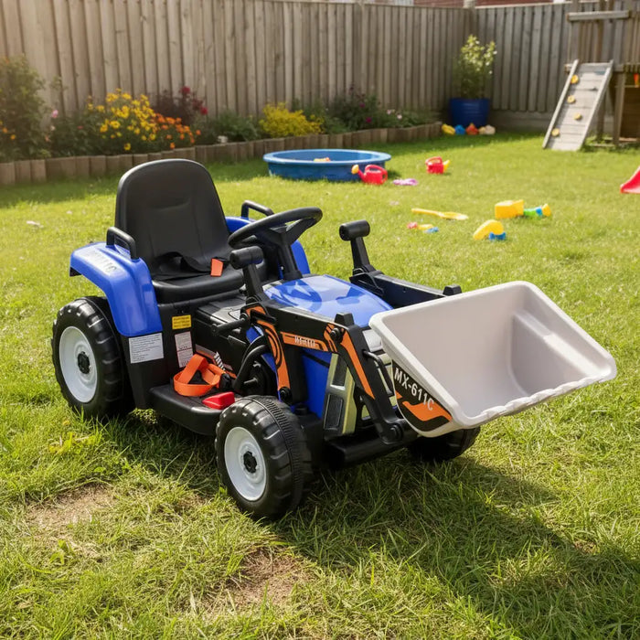 Children's toy tractor with a front loader on a grassy area