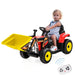 Child sitting on a toy construction vehicle with a remote control on a white background