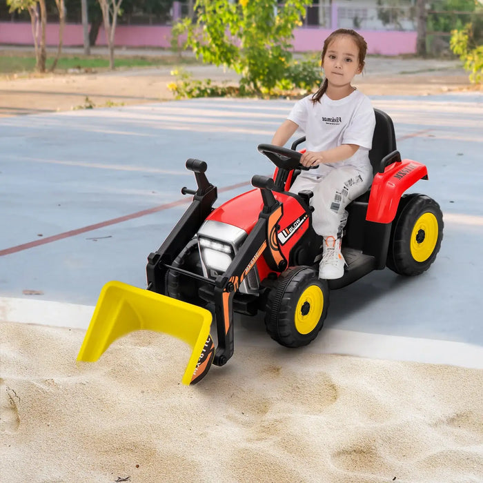 Child playing with a red toy bulldozer on a playground