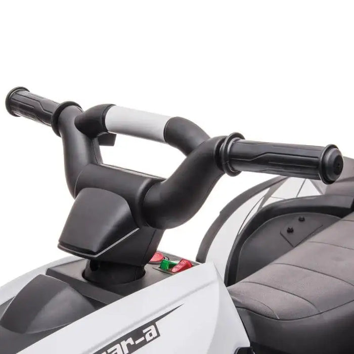 Close-up of handlebars on white 12V kids ride-on quad ATV bike with control buttons