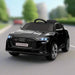 Black 12V Audi e-tron kids electric ride-on car with LED headlights on road