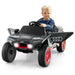 Child driving black Audi e-tron kids electric ride-on car with lights on and open doors