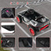 12V licensed Audi e-tron kids ride-on car, black with red wheels, safety features highlighted