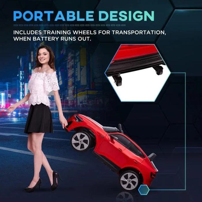 Woman carrying red Audi e-tron kids ride-on car with training wheels for portability