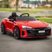 Red 12V Audi RS e-tron GT kids electric ride-on car with LED lights on pavement