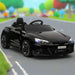 Black Audi RS e-tron GT kids ride-on car with LED lights on a toy road