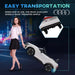 Woman pulling white 12V Audi RS e-tron GT kids ride-on car with rear wheels, city background