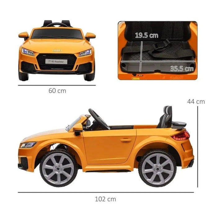 Yellow 12V Audi TT RS kids ride-on car with headlights, seatbelt, and size dimensions shown
