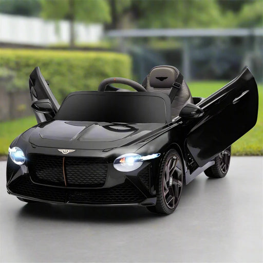 12V black Bentley Bacalar kids electric ride-on car with butterfly doors open, outdoors