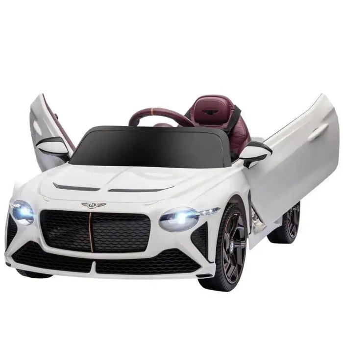 White kids' Bentley Bacalar electric ride-on car with butterfly doors open and headlights on