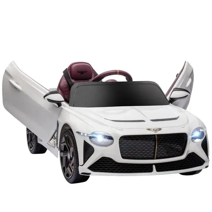 White 12V Bentley Bacalar kids electric ride-on car with open butterfly doors and headlights on