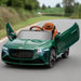 Green 12V Bentley Bacalar kids ride-on car with butterfly doors open on a road