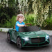 Child driving green Bentley Bacalar 12V kids ride-on car outdoors with flowers
