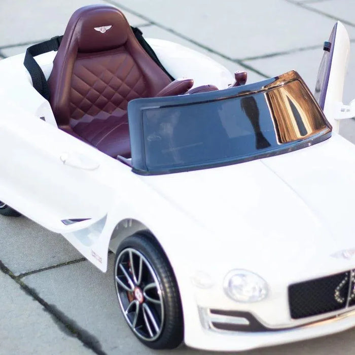 12V white licensed Bentley kids electric ride-on car with open door and brown seat