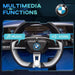 BMW i4 kids ride-on car dashboard with multimedia music and horn functions highlighted