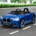 Blue 12V BMW i4 kids ride on car with remote, music, lights, driving on street