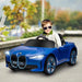 Child driving blue 12V BMW i4 kids ride on car with lights outdoors