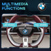BMW i4 kids ride-on car steering wheel with music and horn multimedia functions shown